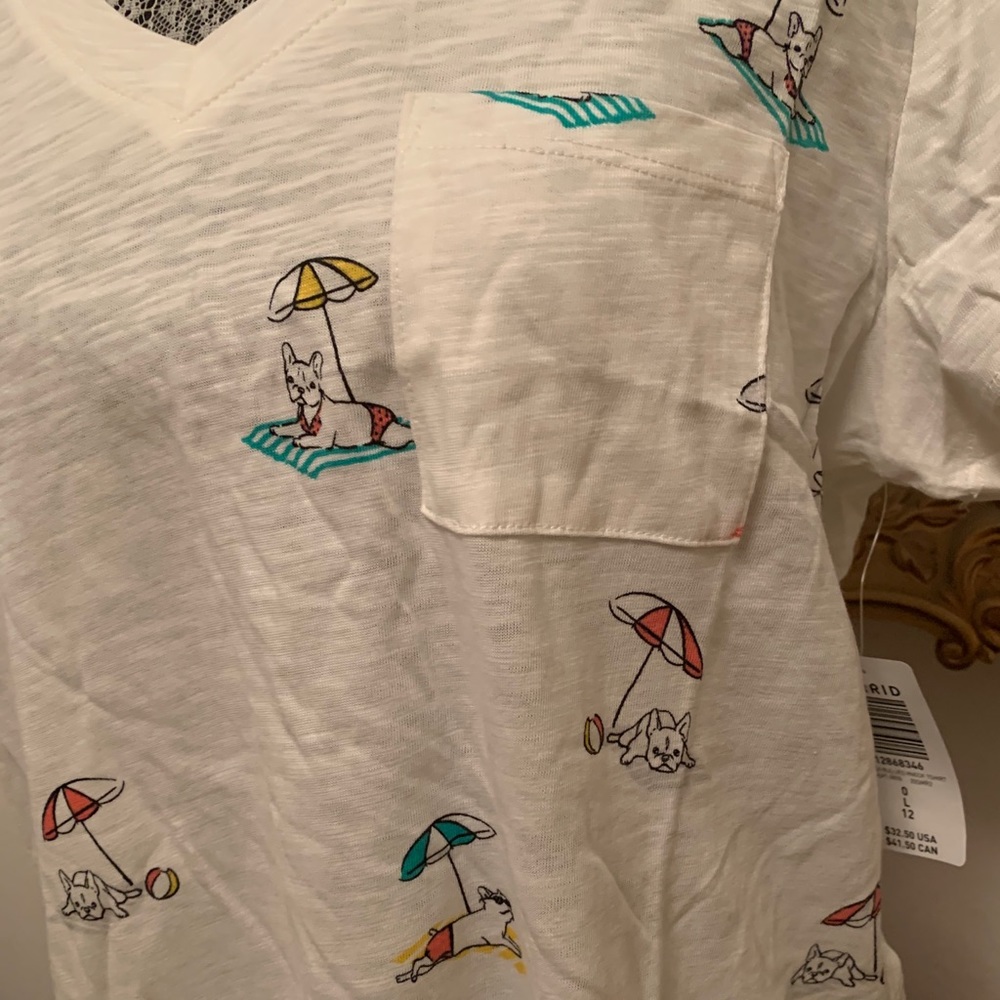 Brand new Frenchie tshirt laying on towel